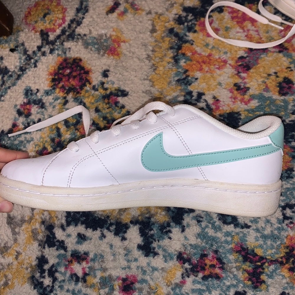 nike white shoes with green logo